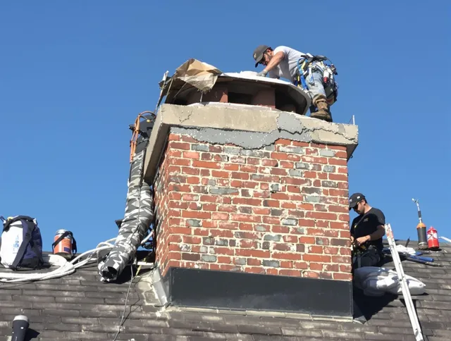Berea Chimney Sweep installing a custom chimney crown in Berea, OH