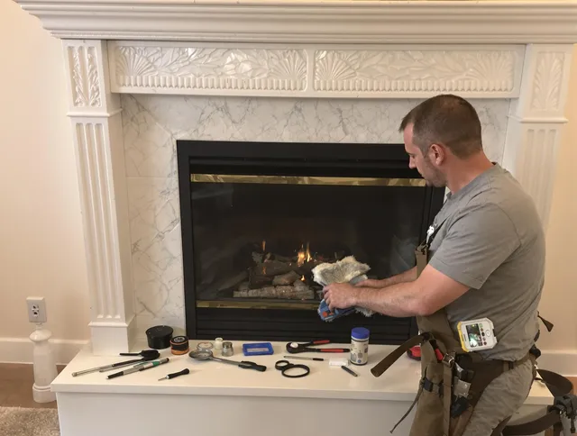 Berea Chimney Sweep performing fireplace maintenance in Berea, OH