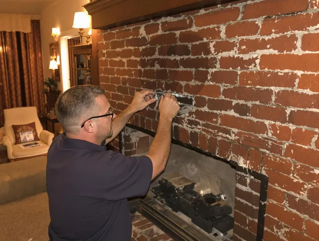 Berea Chimney Sweep expert fixing a fireplace in Berea, OH